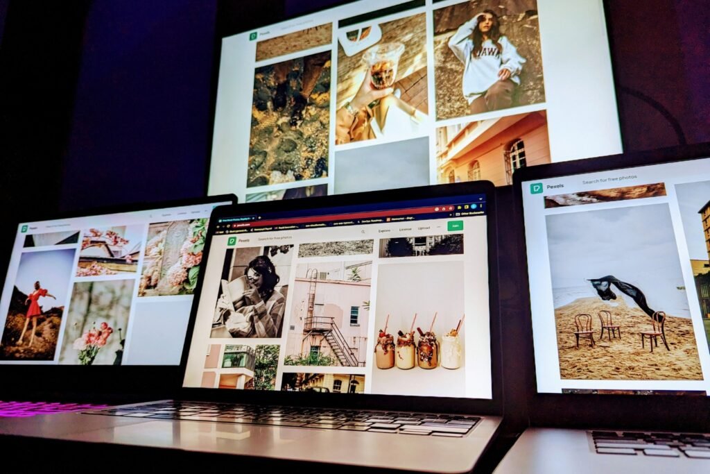 Multiple screens displaying visual content during a Pinterest batching and planning workflow